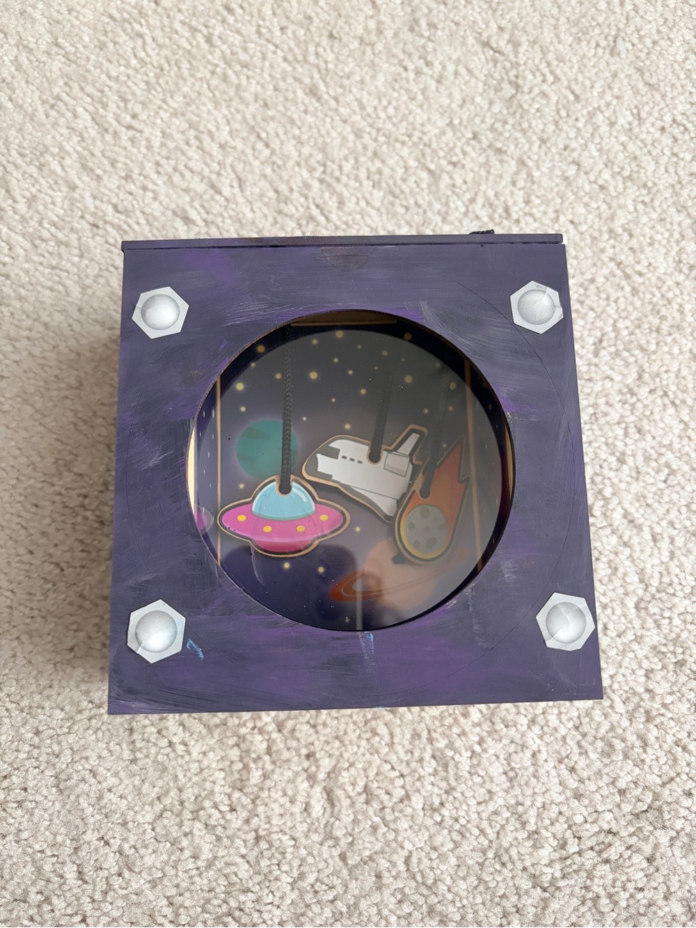 Space-Themed Purple Wooden Toy Box with Hanging Mobile